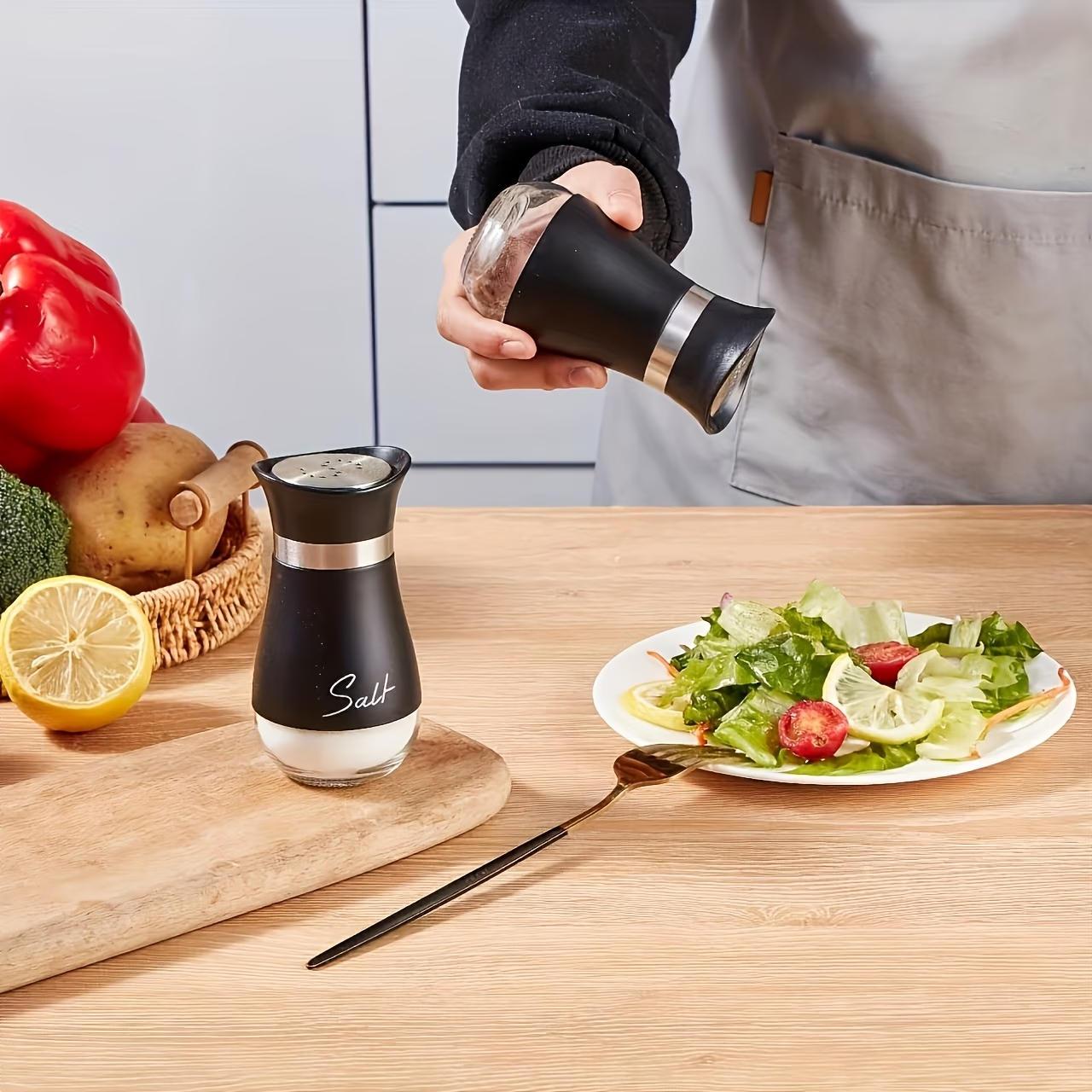 4-piece set (2 bottles + 2 caps) of adorable glass salt and pepper shakers. 4 oz (approx. 113.4g) glass salt and pepper shakers with stainless steel caps, suitable for kitchen dining tables, RVs, camping, and BBQs. Condiment