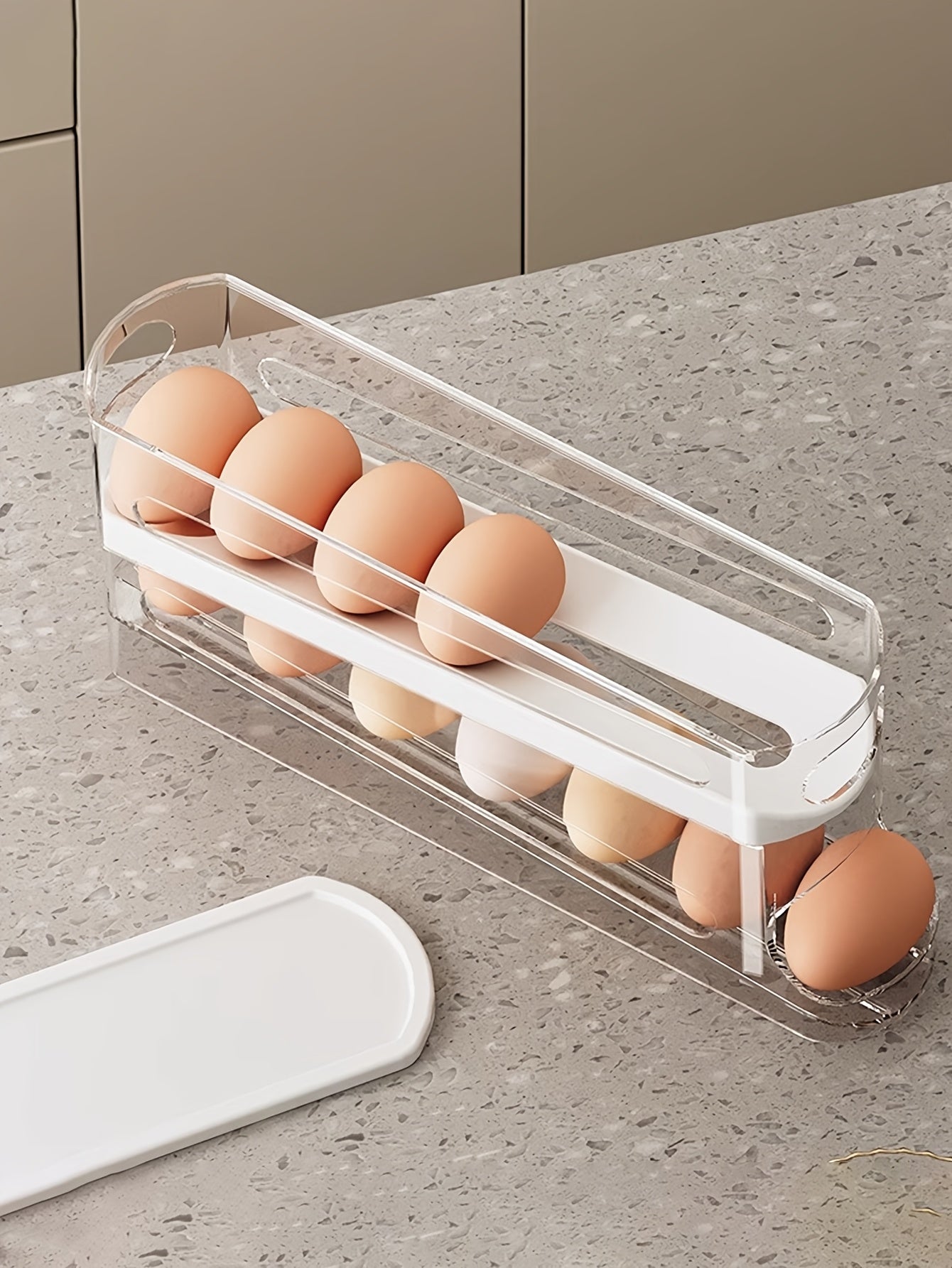 Automatic Egg Storage Box for 12-14 Eggs with a Double-Layer Sliding Design - a Fresh Egg Organizer with a Flip Cover, an Essential Kitchen Solution for Storing Eggs And a Space-Saving Egg Rack for The Refrigerator.